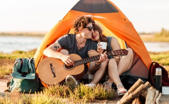 portrait-of-a-man-playing-guitar-for-his-girlfrien-PSKYV3C.jpg